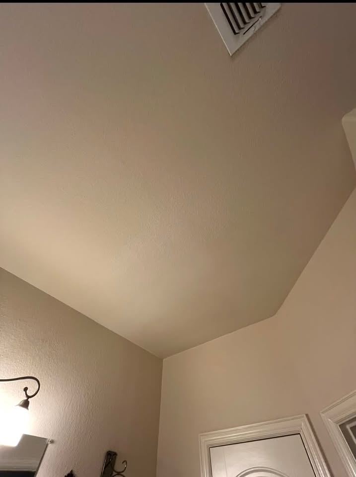 The same ceiling corner finished and blended into the surrounding texture
