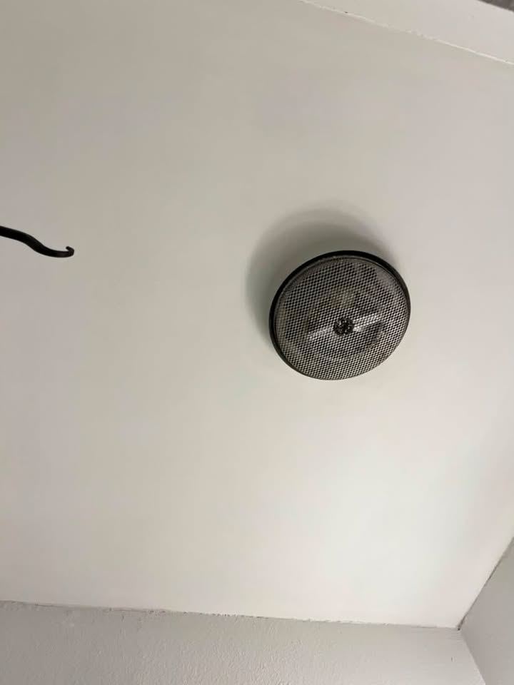 The same ceiling refinished smooth around the same fixture
