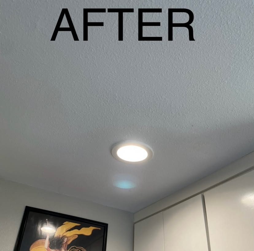 The same recessed light after repair, with the ceiling finished flat and the texture matched around the fixture